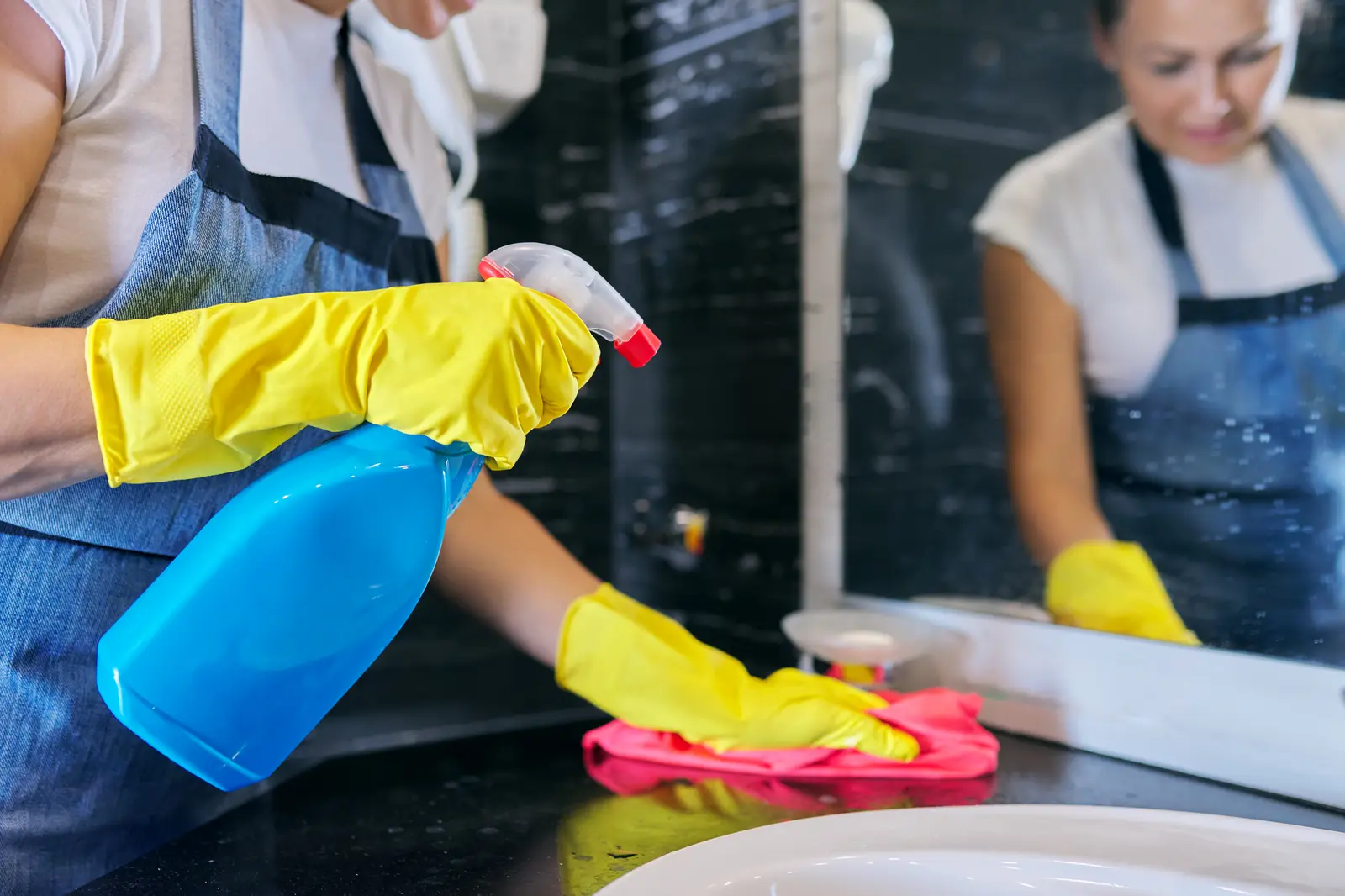 Cleaning a bathroom vanity and mirror