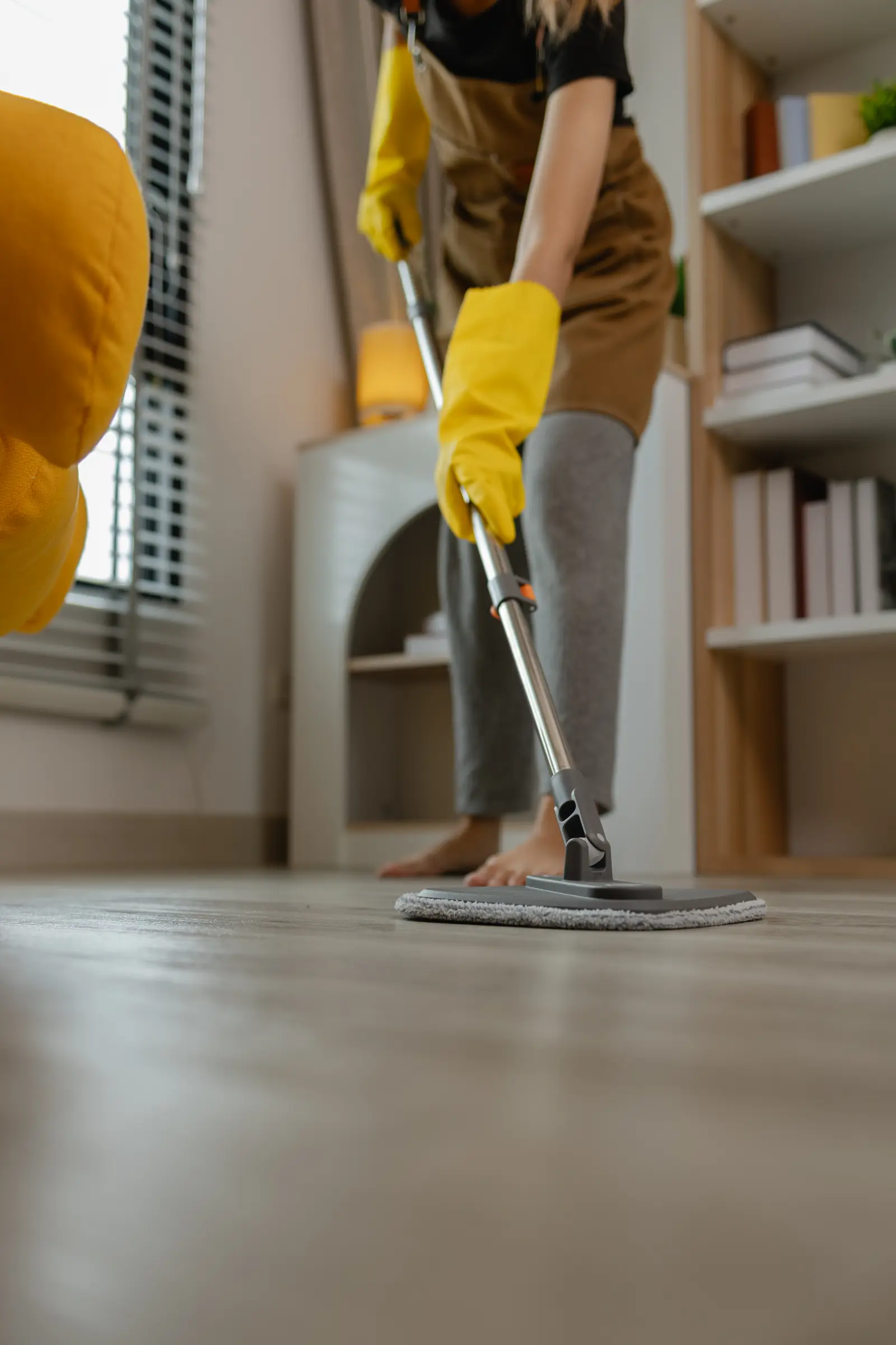 Mopping a hardwood floor with a microfiber mop
